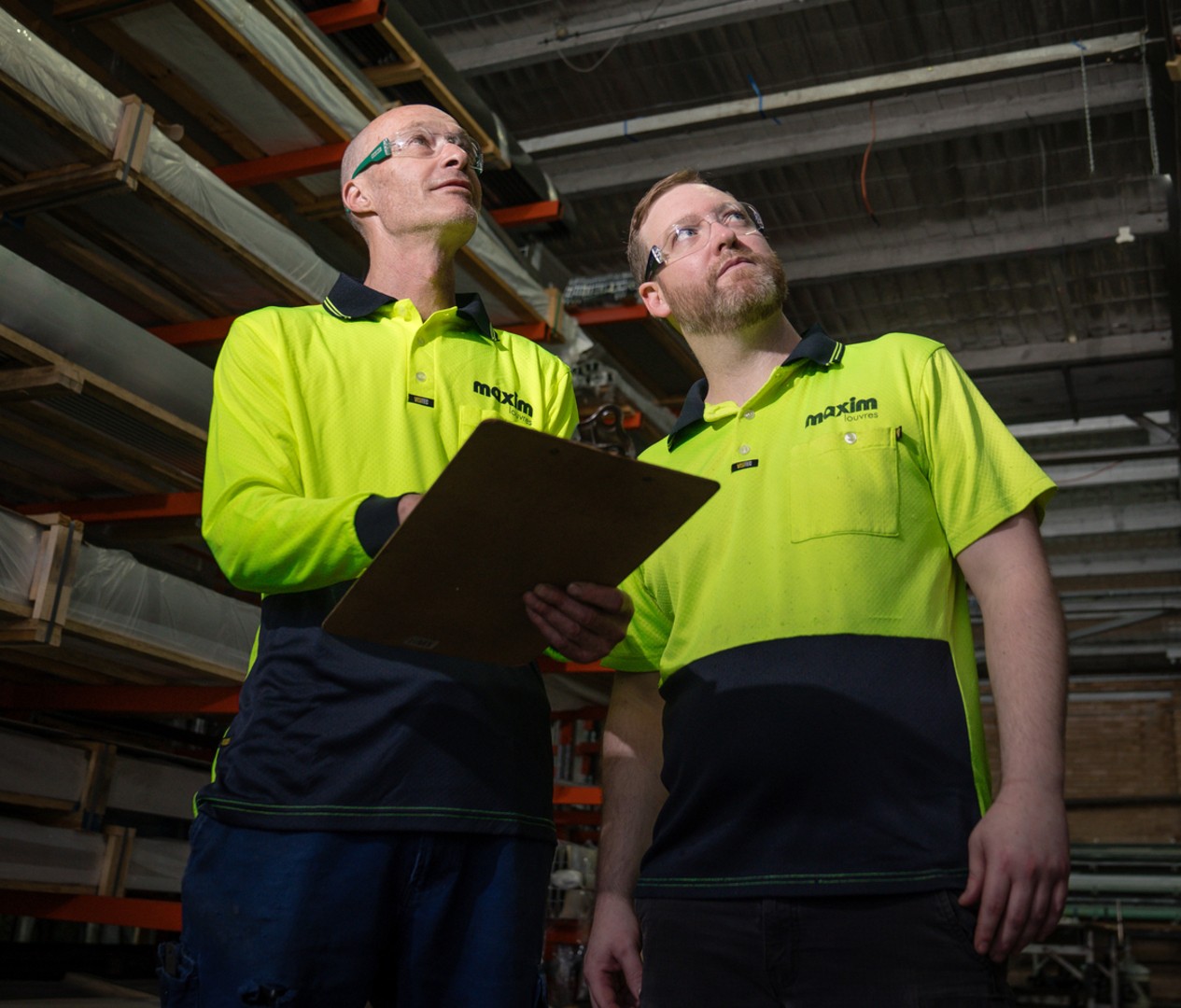 Maxim Factory Staff Discussing Production Processes